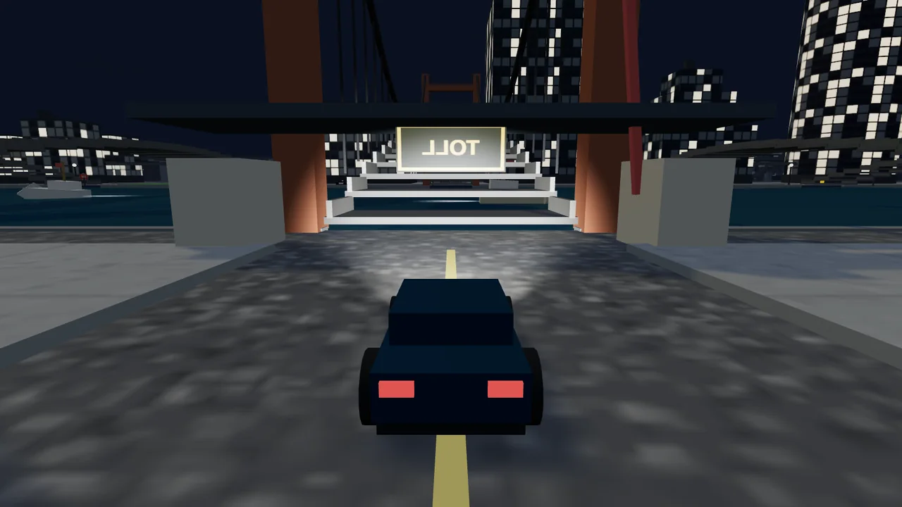 The lit-up bridge toll gate and city skyline at night